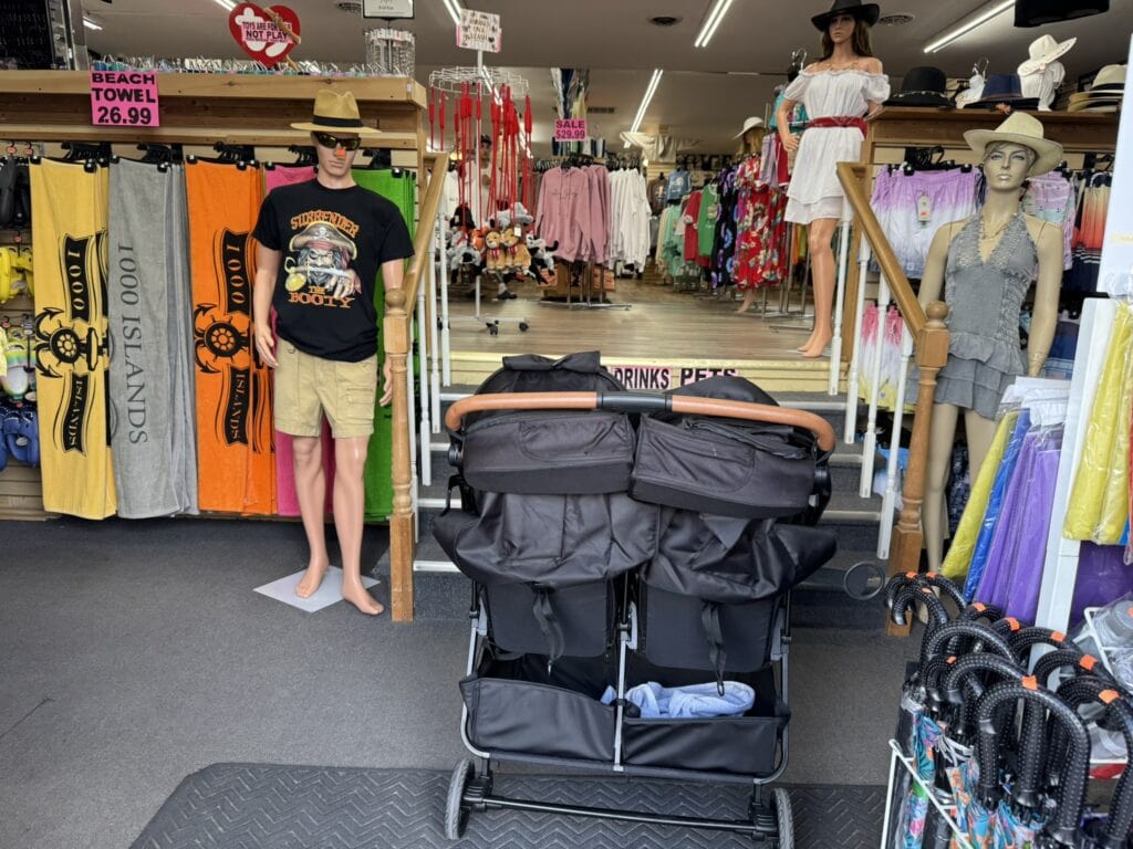 Double stroller blocked by stairs at entrance of souvenir shop in Alexandria Bay