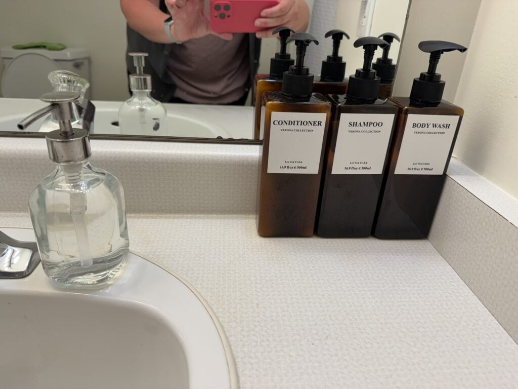Refillable bottles of shampoo, conditioner, and body wash provided in The Lighthouse unit at The Ledges Resort And Marina.