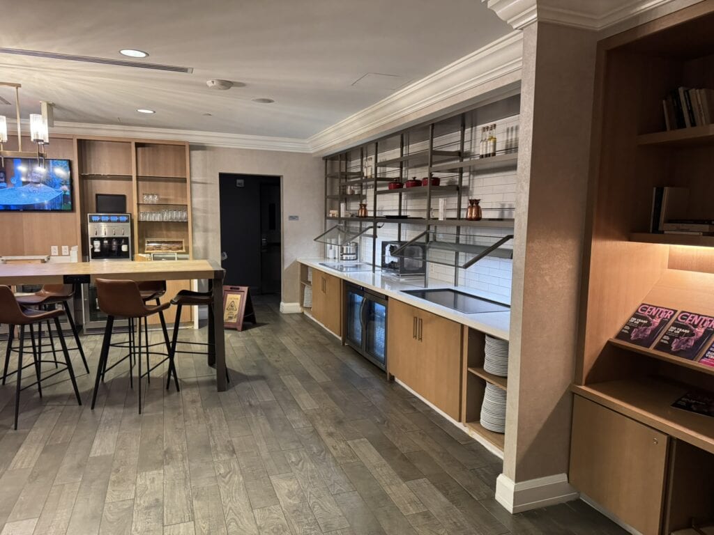 M Club lounge at Washington Marriott Georgetown with seating, snacks, and drink stations for guests